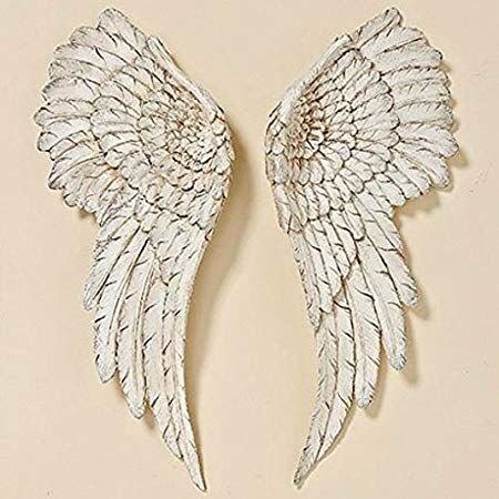 Wing-shaped iron wall decoration– a historic and romantic touch in the interior